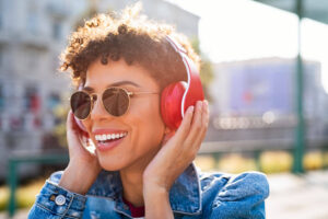 Happy african woman with headphones